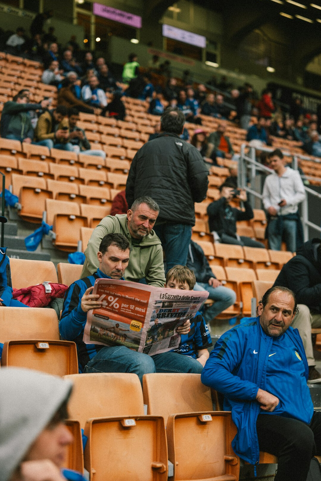crowd reading articles