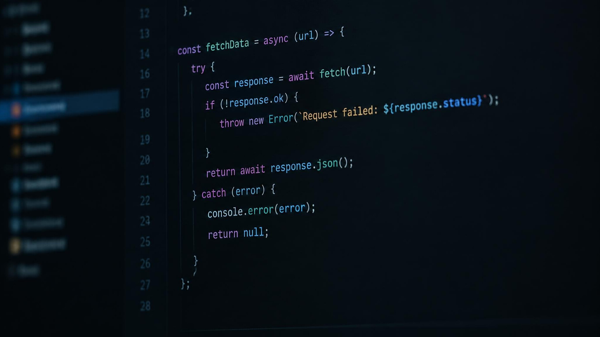 Close up of source code on a dark monitor